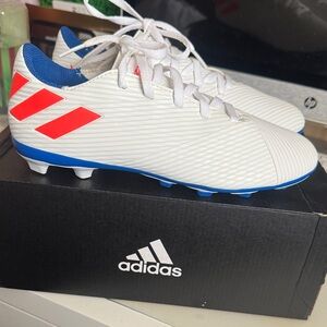 Adidas White and Red Cleats with Blue Soles